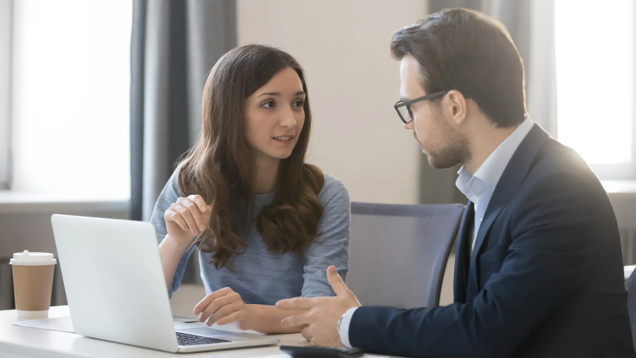 man consulting to a women about accounting and cfo services