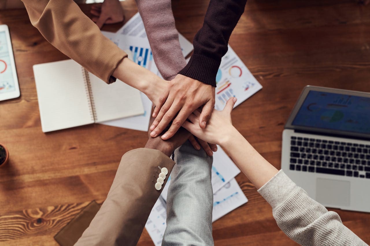 all hands comes together on each other